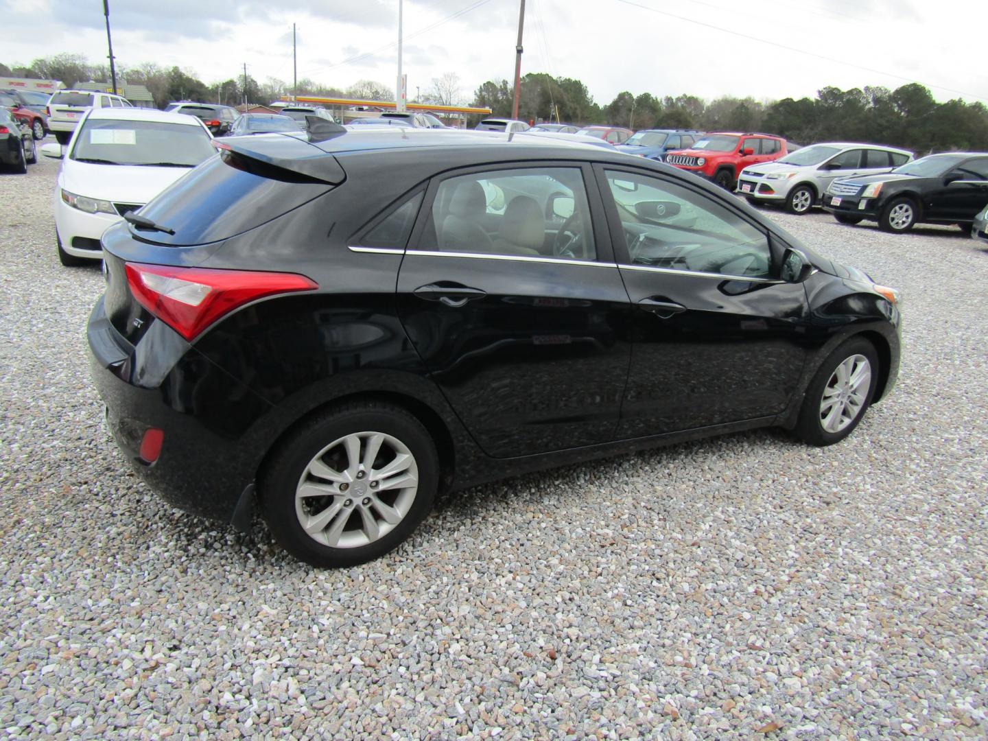 2013 Black Hyundai Elantra GT A/T (KMHD35LE1DU) with an 1.8L L4 16V DOHC engine, 6-Speed Automatic transmission, located at 15016 S Hwy 231, Midland City, AL, 36350, (334) 983-3001, 31.306210, -85.495277 - Photo#7